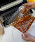 Using Game Changer Vacuum Sealer For Home Food Storage With LiquidLock Tech And Liquid Mode to seal soup in clear vacuum bag