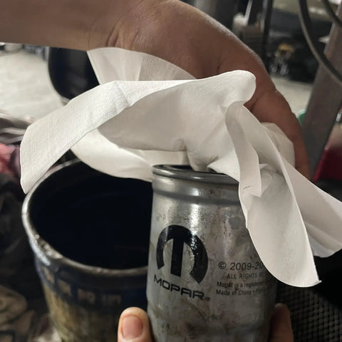 Top Notch Heavy Duty Industrial Shop Towels Multipurpose Cleanroom Wipes 500 Count being used to clean a grease can.