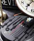Two Piece High Torque Long Shaft Clock Movements With Five Pairs Of Hands, DIY Clock Repair Kit, parts on display table
