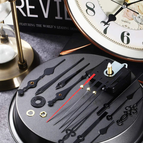 Two Piece High Torque Long Shaft Clock Movements With Five Pairs Of Hands, DIY Clock Repair Kit, parts on display table