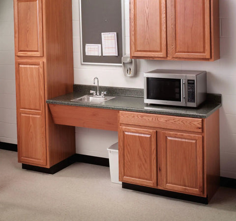 Wooden kitchen setup with a commercial bar and pantry faucet 2.2 GPM chrome finish and microwave nearby.