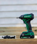 Cordless 18V Impact Driver Sub-Compact Brushless, 1/4 In Hex shown on wooden surface with screws, outdoor setting