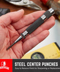 Center punch tool with knurled black grip and pointed steel tip, held in hand.