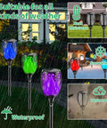 Outdoor RGB Solar Flame Lights 4 Pack With Seven Color Flickering Fire Effect in rain showing waterproof feature, glowing in varied colors.
