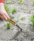 Durable Hand Weeder Sickle Tool With Hardwood Handle for easy weeding, soil loosening, showing stainless steel blade in use