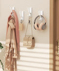 Heavy Duty Adhesive Wall Hooks 13Lb Aluminum No Damage To Wall Four Pack holding coat, purse, headphones in room