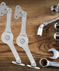 Soft Close Cabinet Door Hinges With Lift Stay Support And Hydraulic Damper, 2 Pack on wooden surface with tools nearby