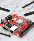 Red PCB with 30 Piece 2.54mm 40 Pin Male And Female Header Pins Set for DIY projects and electronic prototyping.