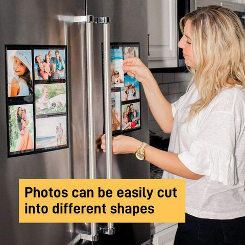 Person attaching 8 by 10 inch magnetic sheets with adhesive backing and photos to a refrigerator, showcasing strong hold on metal surfaces.