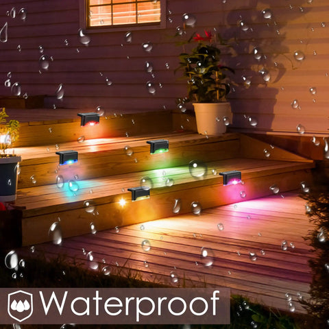 Solar Pool Side Lights 4 Pack Color Changing Waterproof LED Deck Lights illuminating stairs at night with colorful glow