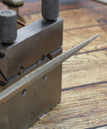 Swiss Style Miter Cutting Vise Jig for Metalworking, Solid Steel Build, 2.75 by 2 Inches, shown holding wire and file for accuracy.