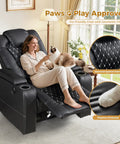 Woman lounging with cat on power recliner chair with USB ports and cup holders for home theater vibes and cozy movie nights.