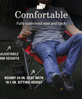 Person sitting in a Broadband Mesh Quad Camping Chair With Carry Bag And Cup Holder, showing adjustable arm heights and roomy seat.