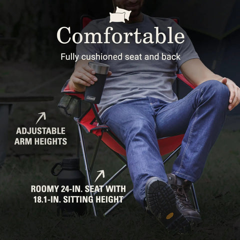 Person sitting in a Broadband Mesh Quad Camping Chair With Carry Bag And Cup Holder, showing adjustable arm heights and roomy seat.