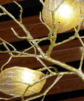 Make Your Spot Hit Different With This Top Notch Nine Light Art Branch Ceiling Pendant Light Featuring Chinese Zen Inspired Hanging Design And Durable Metal Build. Close-up of gold metal branches with glowing glass light shades.