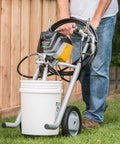 Crush Huge Painting Jobs Straight Up With Heavy Duty Mobile Airless Paint And Stain Sprayer Cart in use with paint bucket.