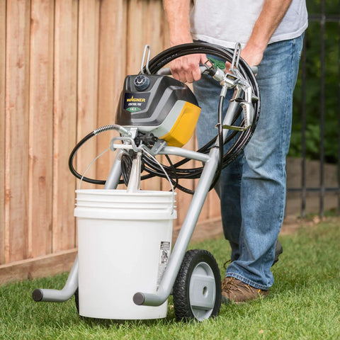 Crush Huge Painting Jobs Straight Up With Heavy Duty Mobile Airless Paint And Stain Sprayer Cart in use with paint bucket.