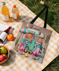 Flame Bird Camping RV Themed Tote Bag For Women on a picnic blanket with drinks and fruit, featuring flamingos and a camper print.