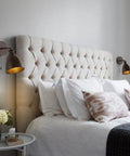 Oil Rubbed Bronze Farmhouse LED Wall Sconce Duo With Pull Chain Slick Industrial Bedroom Lighting 6.5 Inch Metal Shade Hardwired Set Of 2 LED Bulbs Included in a cozy bedroom setting with a tufted headboard.
