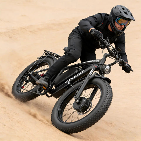 Rider on Beast 6000W Dual Motor Ebike for Adults with 24 inch fat tire and lockable suspension on sandy terrain