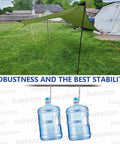 Adjustable Portable Tent Poles 74.8 Inches Beefy Rustproof Thickened Iron Stakes shown supporting tarp outdoors