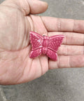 Ceramic Butterfly Cabinet Knobs Set Pink, 6 Pack Vintage Drawer Pulls, single knob held in hand showing details.