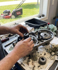 Person installing 2 Pack Pinion Gears 1315399 For 22 Inch Recycler And Personal Pace Lawn Mowers Replacement 1109417