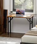 Compact Folding Computer Desk 35.8 Inch No Assembly Required Ready To Use Perfect For Small Spaces next to bed with laptop and coffee