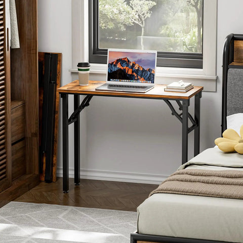 Compact Folding Computer Desk 35.8 Inch No Assembly Required Ready To Use Perfect For Small Spaces next to bed with laptop and coffee