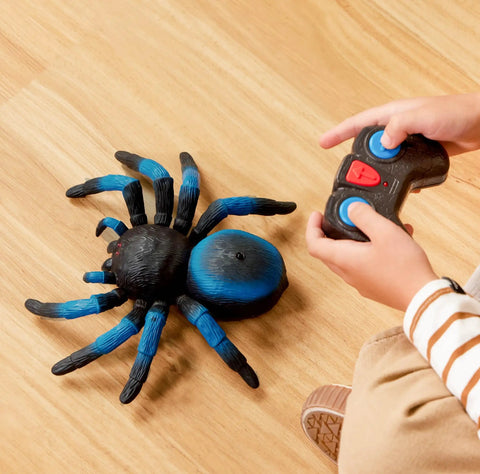 Child playing with Remote Control Tarantula For Kids With LED Eyes Realistic Spider Toy With Moving Legs Fast Speed And 360 Degree Spin