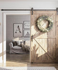 Eight Point Two Foot Sliding Barn Door Hardware Kit With Smooth Quiet Track Easy To Install Includes Step By Step Installation Instructions Fits Forty Eight Inch Wide Door Panel J Shape Hanger Beefy Alloy Construction With Black Powder Coat shown in a cozy living room scene.