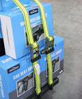 Heavy Duty Ratchet Straps 4 Pack 1-1/2 X 15 Ft With Coated Steel Ratchet And Double Thick Polyester Webbing For Scratch Free Tie Downs, 3,000 Lbs Break Strength, 1,000 Lbs Working Load Limit, Wire Hook Ends And J Hooks displayed with blue packaging in store.