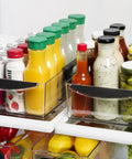 Expandable Pantry And Refrigerator Storage Bins With Locking Tabs Modular Organizers For Fridge Or Pantry Adjustable Length To Fit Shelves visible holding bottles and jars in fridge.
