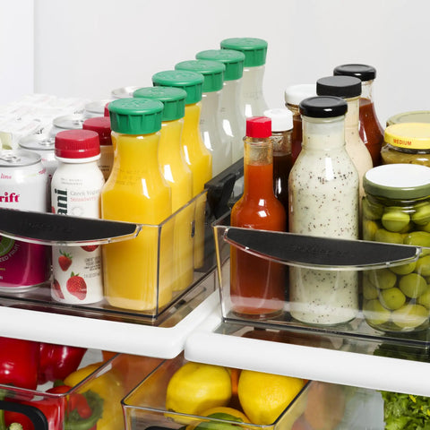 Expandable Pantry And Refrigerator Storage Bins With Locking Tabs Modular Organizers For Fridge Or Pantry Adjustable Length To Fit Shelves visible holding bottles and jars in fridge.