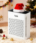 Large Room Air Purifier With HEPA H13 Filtration And Washable Filter in festive living room setting with Santa hat