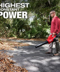 Man using M18 Fuel Dual Battery Cordless Leaf Blower For Yard Cleanup With Turbocharged Airflow And Long Runtime Pro Grade Power.