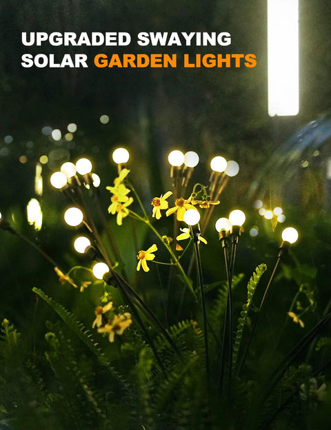 10 LED Starburst Solar Firefly Lights For Outdoors With Swaying Motion illuminating garden with warm white glow at night