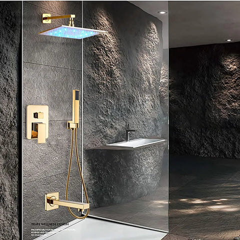 Slick Wall Mount Shower Kit With Led Glow And Tub Spout Boasting Crisp Square Rainfall Head and Handheld Spray on a gray stone wall.