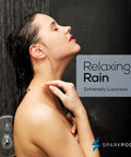 Person enjoying a refreshing shower under the High Pressure 6 Inch Rain Shower Head With 6 Inch Shower Arm Chrome Finish, spa-like setting.