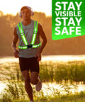 Man wearing high visibility reflective safety vest bulk pack for men and women, breathable mesh lime color, jogging outdoors at sunset