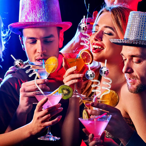 Partygoers enjoying cocktails with mirror disco ball straws set for party decor shiny silver 70s style reusable straws and disco