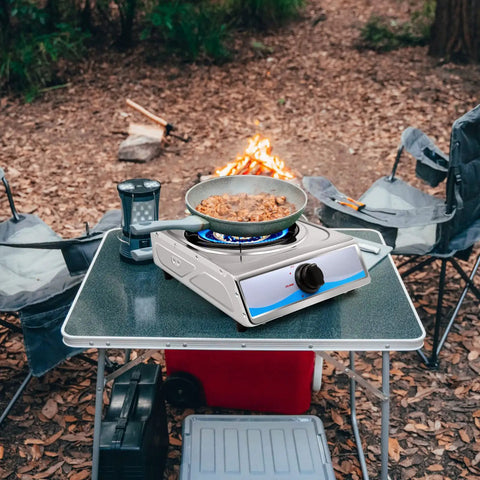 Portable Stainless Steel Single Burner Gas Stove With Auto Ignition Delivers 9800 BTU per hour on a camping table setup.