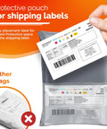 Hand inserting shipping label into gray poly mailer with protective pouch, demonstrating mail bag use for ecommerce sellers.