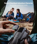 Person holding Lightweight FPV Drone GPS Tracker With Beeper And Buzzer RID Module FAA Compliant, family camping in background