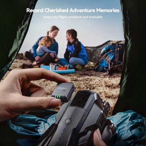 Person holding Lightweight FPV Drone GPS Tracker With Beeper And Buzzer RID Module FAA Compliant, family camping in background