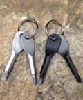 Two Pack Mini Key Shape Screwdriver Set With Flathead And Phillips Bits, Stainless Steel Key Chain Tools on stone surface