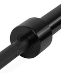 Close-up of Elite Seven Foot Olympic Weight Bar Built Different With Stainless Spin Sleeves showcasing aggressive knurling.