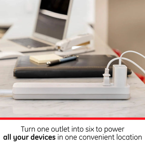 6-Outlet Surge Protector Power Strip Set With 2 Ft Extension Cords, 620 Joules, in use on desk setup with devices, white