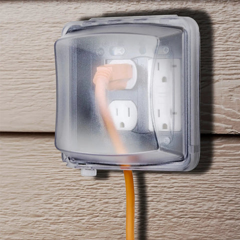 Two Gang Vertical Mount Weatherproof In Use Cover For Outdoor Electrical Boxes 55 In 1 Configurations Two And Three Quarter Inches Deep Clear Finish Quick Fit Mount UV Protected Polycarbonate Fully Paintable Must Have For Any Outdoor Setup, showing cover with outlet on wood siding.