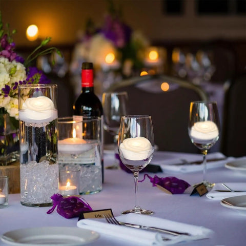 Wedding table with 7 Piece Battery Operated Flameless LED Candles With Remote Timer, waterproof, warm glow, in glass holders